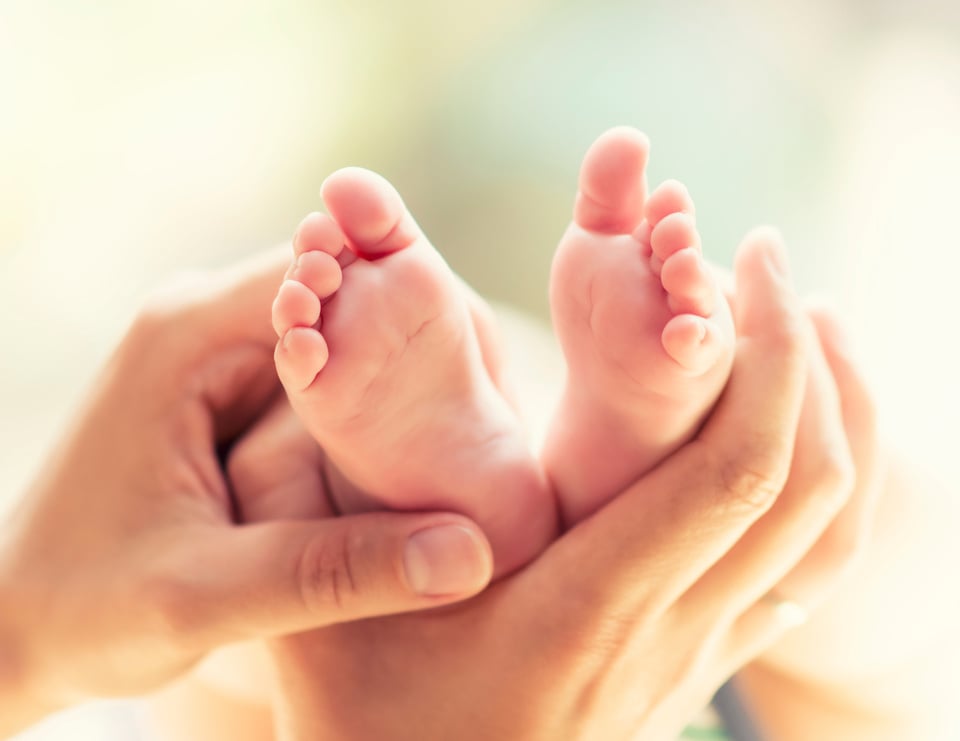 Massaging baby feet